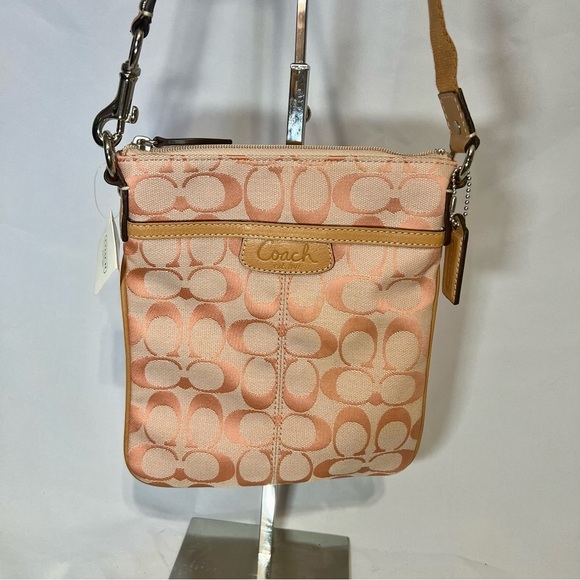 Coach Handbags - NWT Coach Penelope Signature Tangerine Swing Pack Crossbody Bag F43631